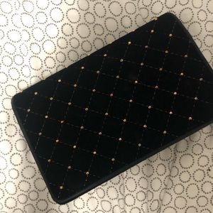 Black and gold stud purse